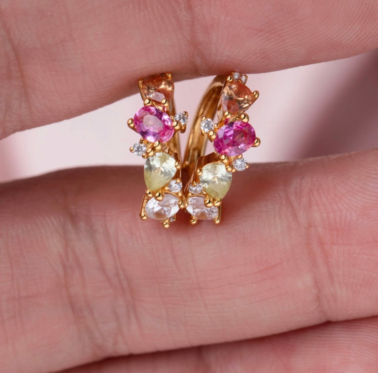 Crafted from premium 925 sterling silver and finished with 18K gold PVD plating, The Confetti Hoops offer lasting shine, durability, and a smooth, high-quality finish. The petite hoop silhouette keeps the design elegant and balanced, while the multi-coloured stones create a cheerful, confetti-like sparkle that brightens any