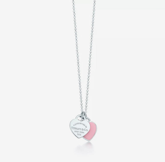 Silver double heart Tiffany-style necklace with pink heart tag and bead chain.