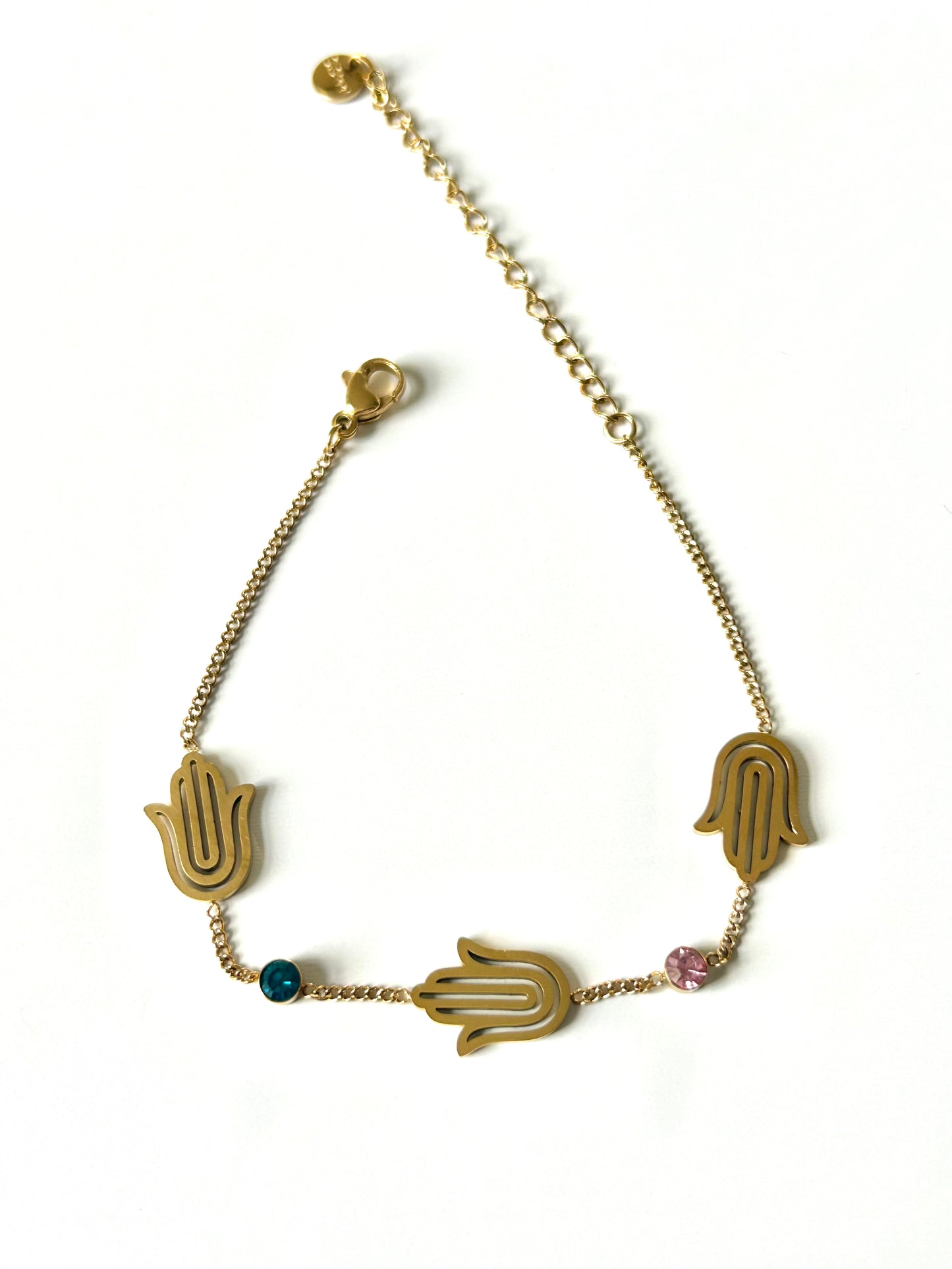 Elevate your style with the Horizon’s Watch Bracelet, a masterpiece of sophistication and elegance. Crafted from durable stainless steel and plated with three luxurious coats of 18k gold, this bracelet seamlessly blends durability with opulence. The centrepiece of this stunning accessory is an intricately designed evil eye motifs, embellished with high-end zircon accents for a touch of shimmering allure. Perfect for adding a hint of glamour to any outfit, the Horizon’s Watch Bracelet is not just a piece of
