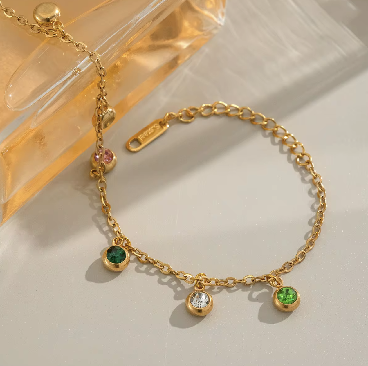 Radiate color and confidence with the Celestial Spectrum Bracelet — a luminous piece that captures the beauty of the cosmos. Crafted from premium stainless steel and dipped in rich gold, this bracelet features a stunning array of multi-coloured diamond simulants that shimmer with every movement.
Elegant yet playful, it’s the perfect statement of luxury for everyday wear or a special night out. The celestial hues reflect light like a starry sky — bold, radiant, and utterly unforgettable.