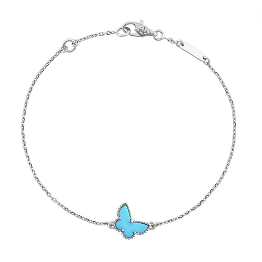 Make sure your style takes flight with our Fly Away bracelet! Made with delicate mother of pearl in blue and white gold, this butterfly-shaped accessory is sure to make a statement—this arm party is ready to spread its wings and soar.