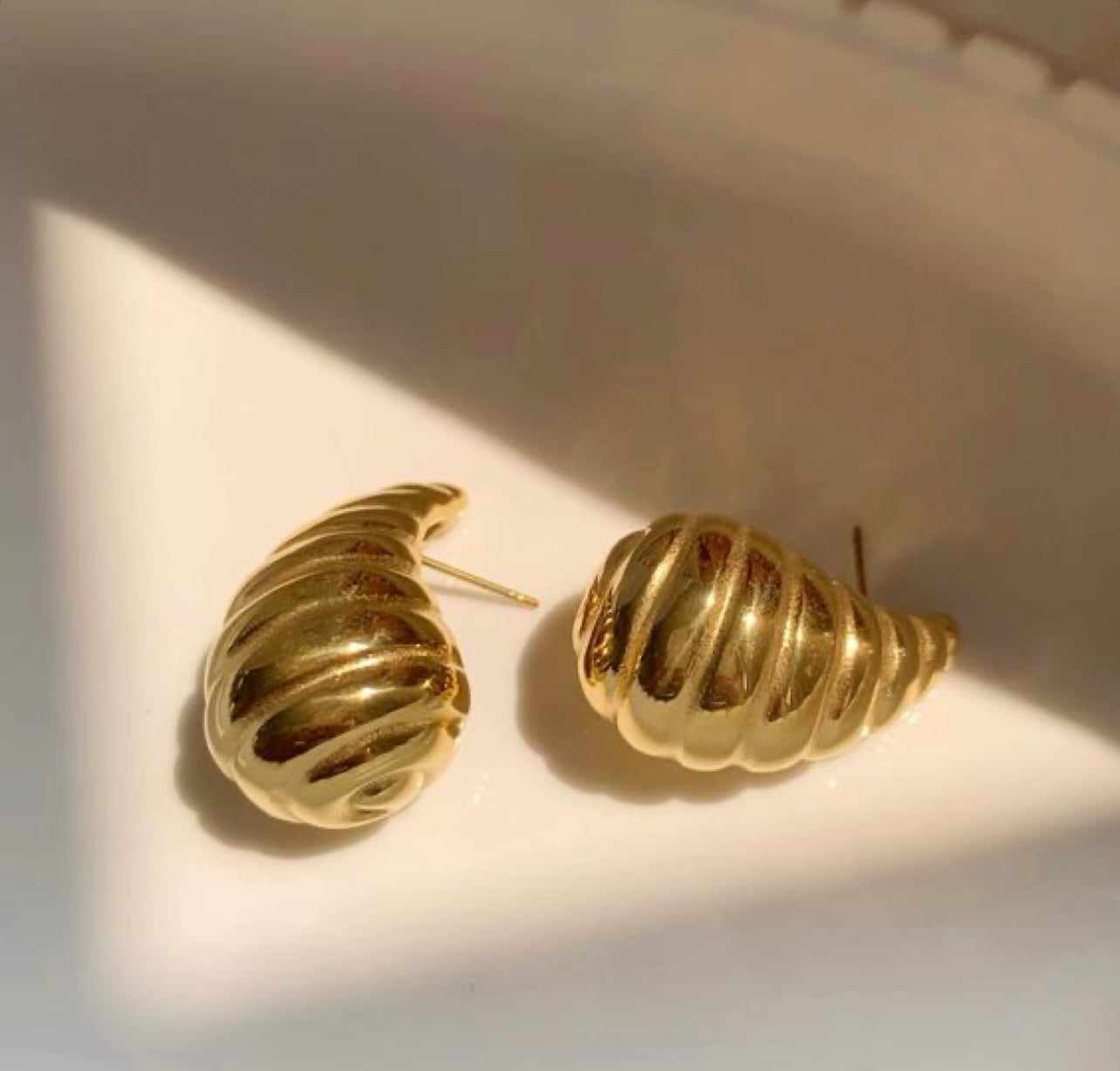 Spiral shell stud earrings gold plated finish