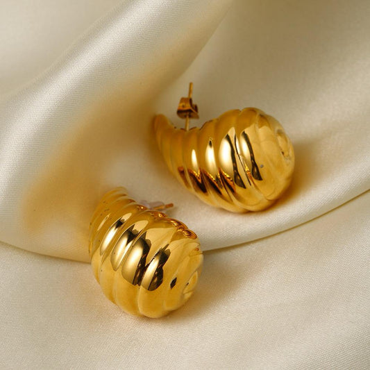 Gold shell stud earrings spiral seashell design