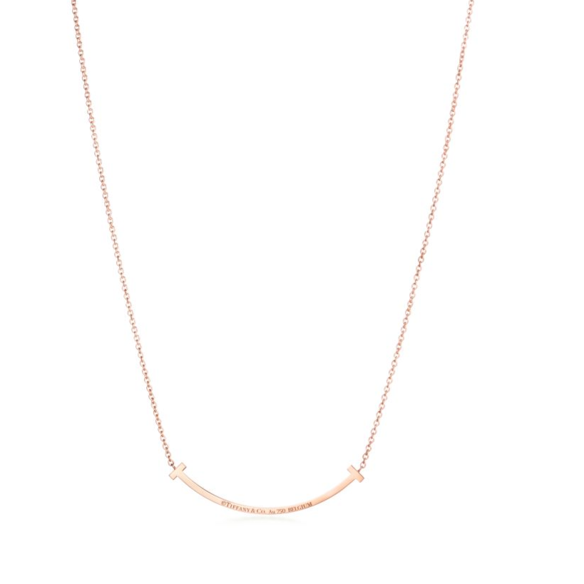 Elegant rose gold necklace featuring a sleek “T” pendant adorned with sparkling premium diamond simulants. The pendant hangs on a delicate adjustable chain, radiating modern luxury and timeless sophistication.