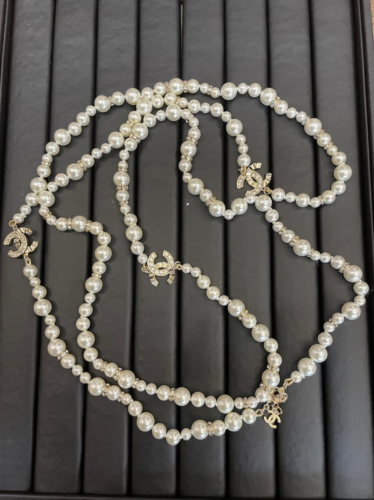 Chanel long pearl necklace with simulated pearls and gold details