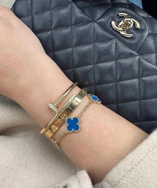 Luxury blue mother of pearl 5 motif gold bracelet close-up