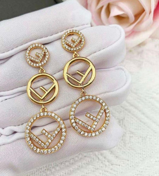 18k gold Fendi style drop earrings featuring sparkling crystal accents.