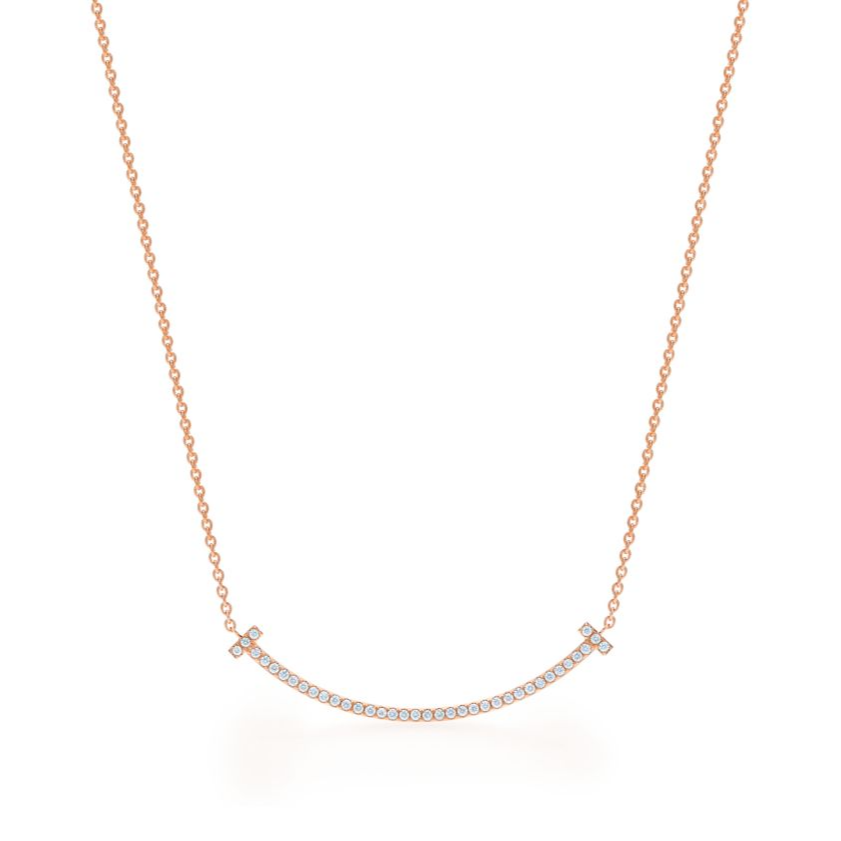 Elegant rose gold necklace featuring a sleek “T” pendant adorned with sparkling premium diamond simulants. The pendant hangs on a delicate adjustable chain, radiating modern luxury and timeless sophistication.