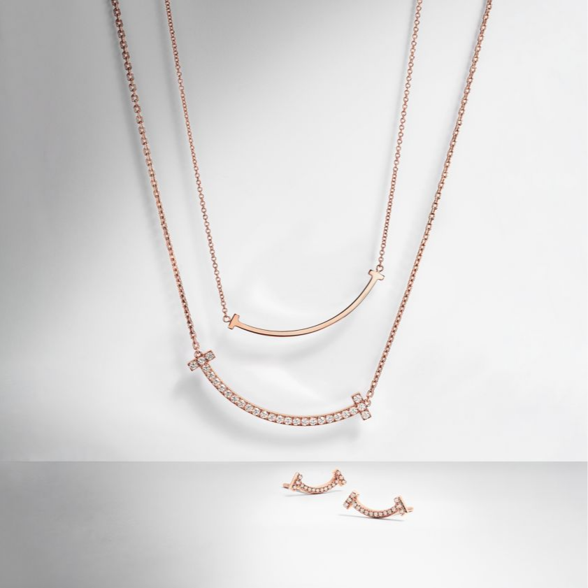 Where modern elegance meets everlasting style. The Timeless T Necklace is a true statement of sophistication — crafted with precision and dipped in luminous 18k rose gold for a radiant, romantic glow. Its sleek, minimalist “T” design symbolizes strength, connection, and balance — making it the perfect piece for the woman who embodies quiet confidence and timeless grace.
Whether worn alone for an understated look or layered for a touch of modern glamour, the Timeless T transcends trends and seasons — a fore