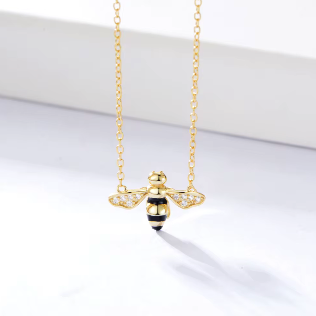 Key Features

• 925 sterling silver base
• 18K gold PVD plating for long-lasting shine
• Clear diamond simulants
• Clear diamond simulant centre stone
• Bee mini design
• Lightweight and comfortable for everyday wear
• Hypoallergenic &amp; tarnish-resistant
• Perfect for stacking or wearing solo
• Ideal for gifting or everyday luxury