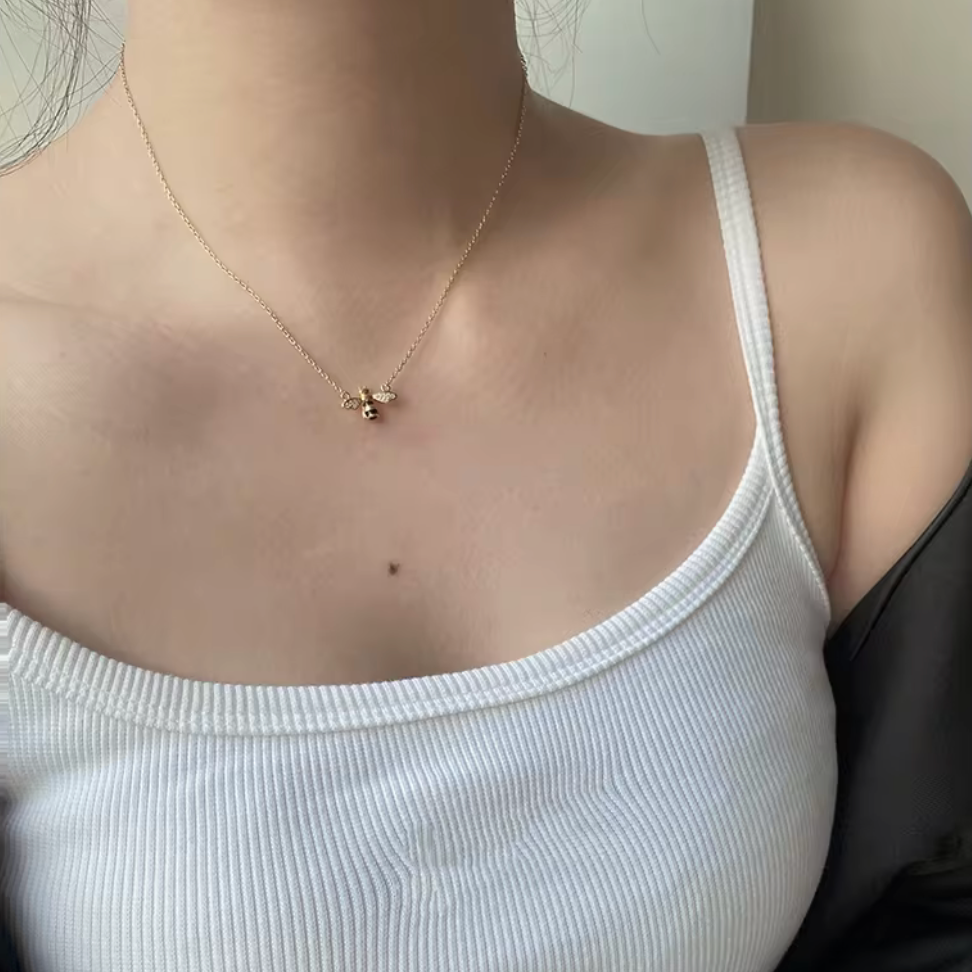 Key Features

• 925 sterling silver base
• 18K gold PVD plating for long-lasting shine
• Clear diamond simulants
• Clear diamond simulant centre stone
• Bee mini design
• Lightweight and comfortable for everyday wear
• Hypoallergenic &amp; tarnish-resistant
• Perfect for stacking or wearing solo
• Ideal for gifting or everyday luxury