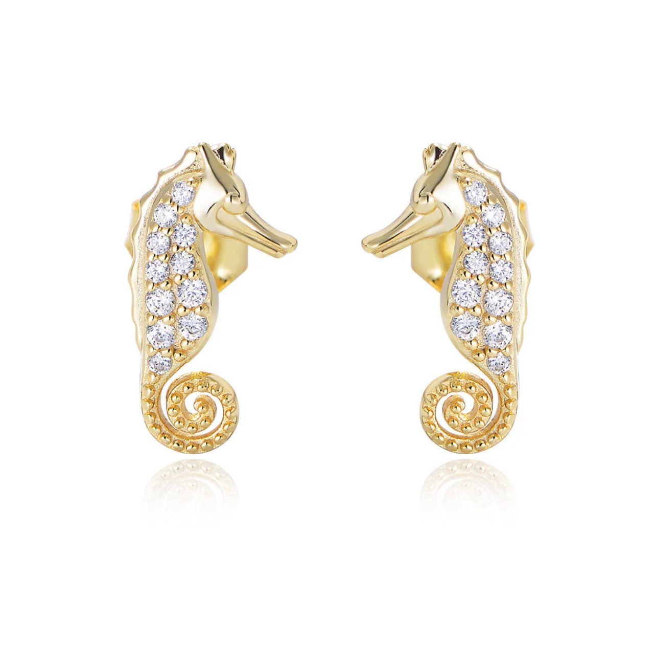 Crafted from premium 925 sterling silver and finished with 18-carat yellow gold vermeil, The Seahorse Studs offer lasting shine, durability, and a luxurious feel. Their petite size and smooth contours make them effortless to wear, while the symbolic seahorse design adds character and meaning without overpowering your look.

Lightweight, hypoallergenic, and tarnish-resistant, The Seahorse Studs are designed for all-day comfort and long-lasting wear. Whether worn alone for a subtle coastal accent or layered w