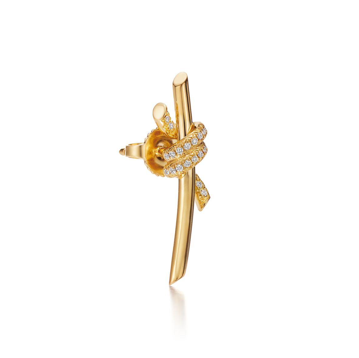 Gold earring with a heart design on a white background Inspired by the timeless elegance of classic design, the Knot of Love Earrings embody the strength of unbreakable bonds and cherished connections. Each piece is meticulously crafted in 18k yellow gold and adorned with hand-set round brilliant diamonds, chosen for their exceptional sparkle and precision. The design symbolizes unity, making these earrings a modern expression of love, devotion, and enduring beauty.