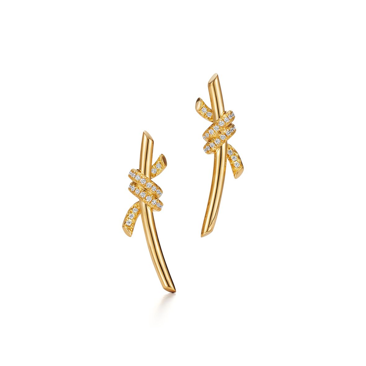 Inspired by the timeless elegance of classic design, the Knot of Love Earrings embody the strength of unbreakable bonds and cherished connections. Each piece is meticulously crafted in 18k yellow gold and adorned with hand-set round brilliant diamonds, chosen for their exceptional sparkle and precision. The design symbolizes unity, making these earrings a modern expression of love, devotion, and enduring beauty.