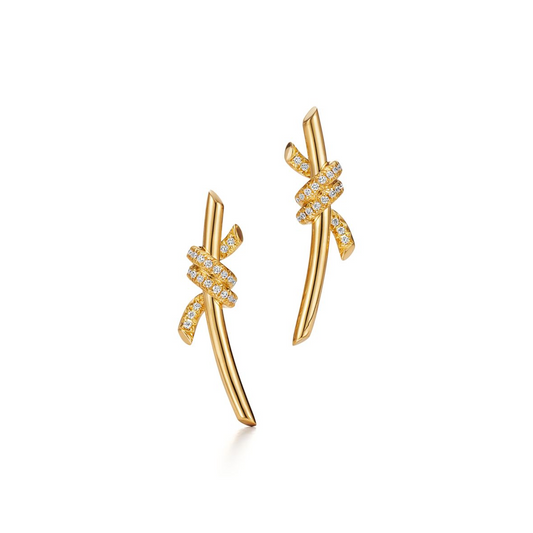 Inspired by the timeless elegance of classic design, the Knot of Love Earrings embody the strength of unbreakable bonds and cherished connections. Each piece is meticulously crafted in 18k yellow gold and adorned with hand-set round brilliant diamonds, chosen for their exceptional sparkle and precision. The design symbolizes unity, making these earrings a modern expression of love, devotion, and enduring beauty.