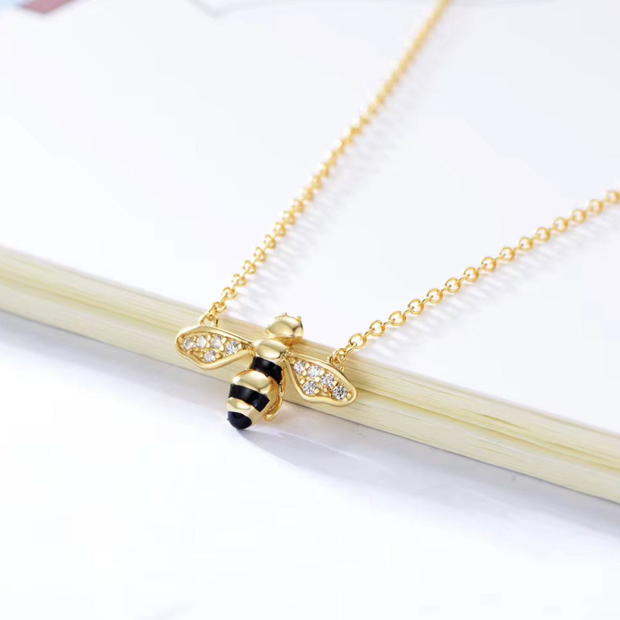 Key Features

• 925 sterling silver base
• 18K gold PVD plating for long-lasting shine
• Clear diamond simulants
• Clear diamond simulant centre stone
• Bee mini design
• Lightweight and comfortable for everyday wear
• Hypoallergenic &amp; tarnish-resistant
• Perfect for stacking or wearing solo
• Ideal for gifting or everyday luxury