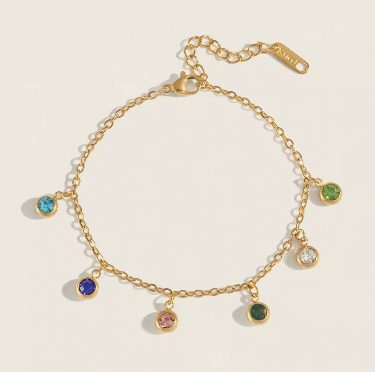 Radiate color and confidence with the&nbsp;Celestial Spectrum Bracelet — a luminous piece that captures the beauty of the cosmos. Crafted from premium stainless steel and dipped in rich gold, this bracelet features a stunning array of multi-coloured diamond simulants that shimmer with every movement.

Elegant yet playful, it’s the perfect statement of luxury for everyday wear or a special night out. The celestial hues reflect light like a starry sky — bold, radiant, and utterly unforgettable.