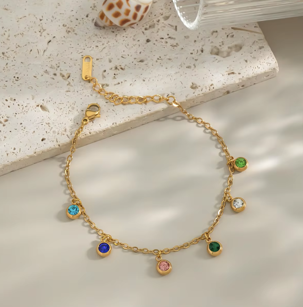 Radiate color and confidence with the&nbsp;Celestial Spectrum Bracelet — a luminous piece that captures the beauty of the cosmos. Crafted from premium stainless steel and dipped in rich gold, this bracelet features a stunning array of multi-coloured diamond simulants that shimmer with every movement.

Elegant yet playful, it’s the perfect statement of luxury for everyday wear or a special night out. The celestial hues reflect light like a starry sky — bold, radiant, and utterly unforgettable.