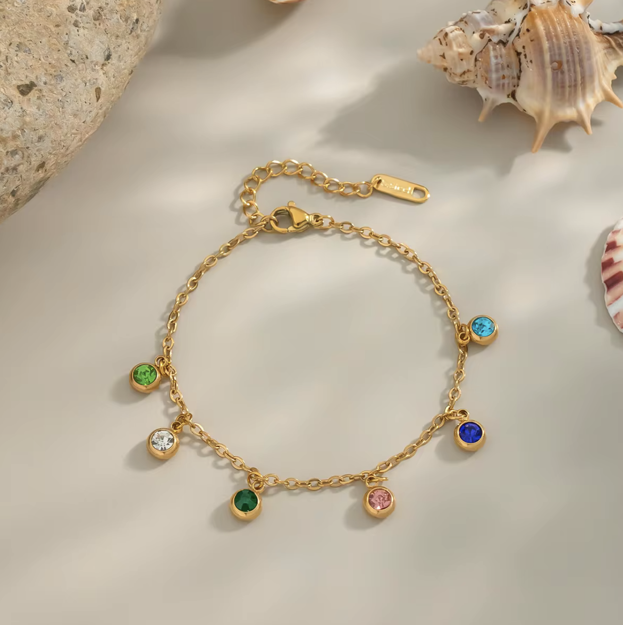 Radiate color and confidence with the&nbsp;Celestial Spectrum Bracelet — a luminous piece that captures the beauty of the cosmos. Crafted from premium stainless steel and dipped in rich gold, this bracelet features a stunning array of multi-coloured diamond simulants that shimmer with every movement.

Elegant yet playful, it’s the perfect statement of luxury for everyday wear or a special night out. The celestial hues reflect light like a starry sky — bold, radiant, and utterly unforgettable.