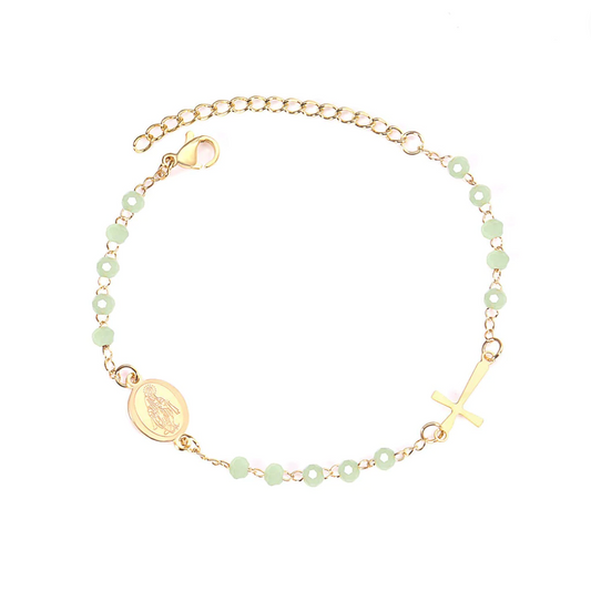 Step into the serene embrace of our 'Golden Meadow Rosary'! Crafted from stainless steel dipped in 18k gold, this enchanting rosary features light green beads and a divine 18k gold cross. At 20 cm, it's a playful fusion of elegance and nature's grace, with an extra 5 cm extension for those days when your style craves a little more sunshine.