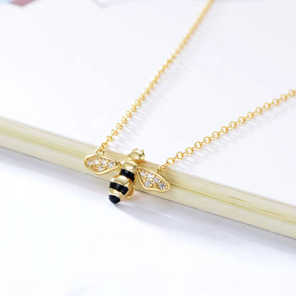 Key Features

• 925 sterling silver base
• 18K gold PVD plating for long-lasting shine
• Clear diamond simulants
• Clear diamond simulant centre stone
• Bee mini design
• Lightweight and comfortable for everyday wear
• Hypoallergenic &amp; tarnish-resistant
• Perfect for stacking or wearing solo
• Ideal for gifting or everyday luxury