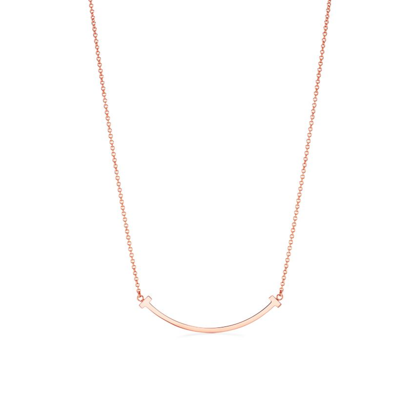 Where modern elegance meets everlasting style. The Timeless T Necklace is a true statement of sophistication — crafted with precision and dipped in luminous 18k rose gold for a radiant, romantic glow. Its sleek, minimalist “T” design symbolizes strength, connection, and balance — making it the perfect piece for the woman who embodies quiet confidence and timeless grace.

Whether worn alone for an understated look or layered for a touch of modern glamour, the Timeless T transcends trends and seasons — a fore