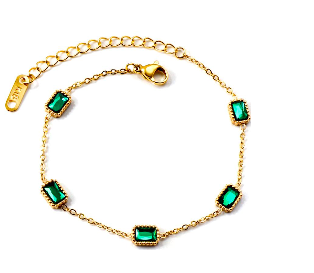 Our "Seattle" Bracelet – a mesmerizing fusion of vibrant green emeralds and sleek stainless steel, delicately dipped in 18K gold. This exquisite piece embodies the spirit of the emerald city, with its lush, rich hues and modern sophistication. Elevate your style with the enchanting allure of genuine emeralds, set against the timeless brilliance of gold-dipped stainless steel